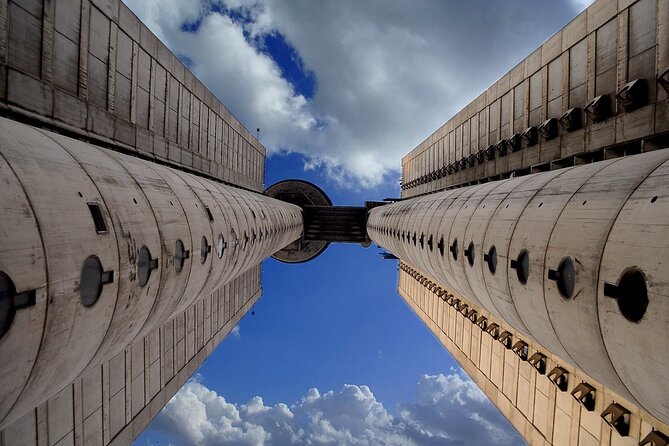 E-Scooter Communist Yugoslavia Tour - Entering Western City Gate, Genex Tower’s Brutalist Moment