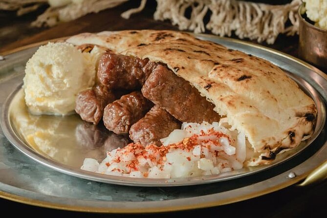 E-Scooter Serbian Food Tour - The tasting menu: appetizers, dry meat, cevapi with kajmak, and dessert